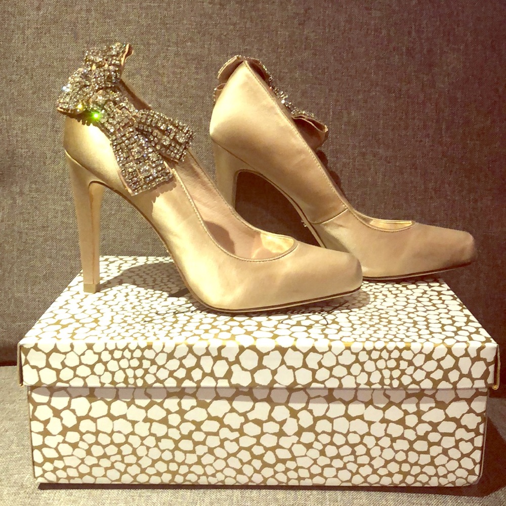 ABS pumps with rhinestone bow.